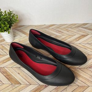 Crocs | women black ionic slip on flats rubber